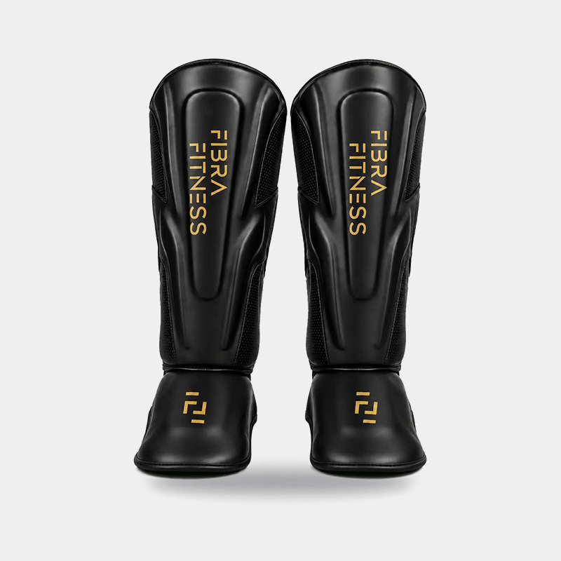 Protector Tibial Tibias Rígidas - Fibra Fitness (Negro/Dorado)